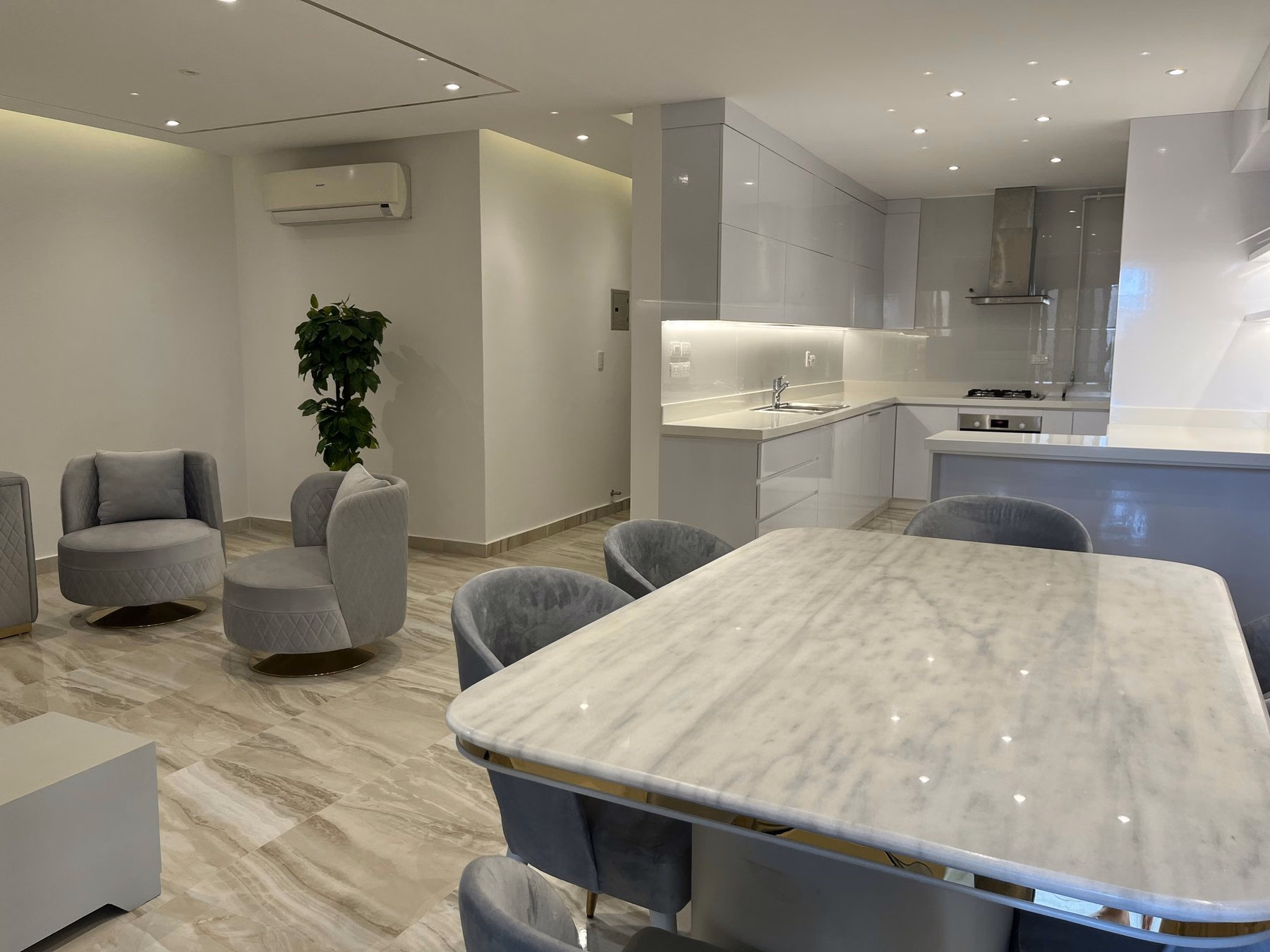 Open-plan dining area connected to the apartment kitchen